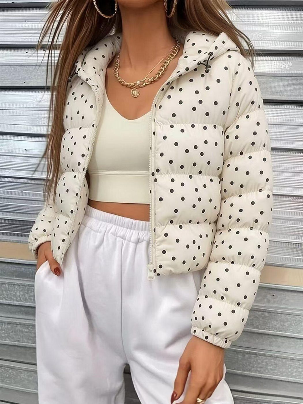 Polka Puffer in cream, worn open over a cream top